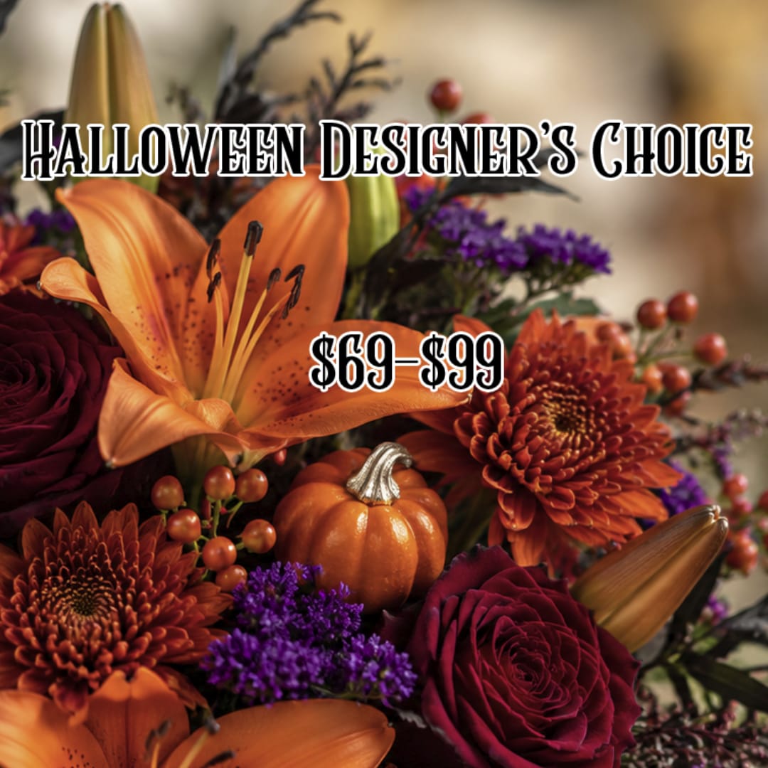 Halloween floral arrangement with orange lilies, burgundy roses, and a small pumpkin