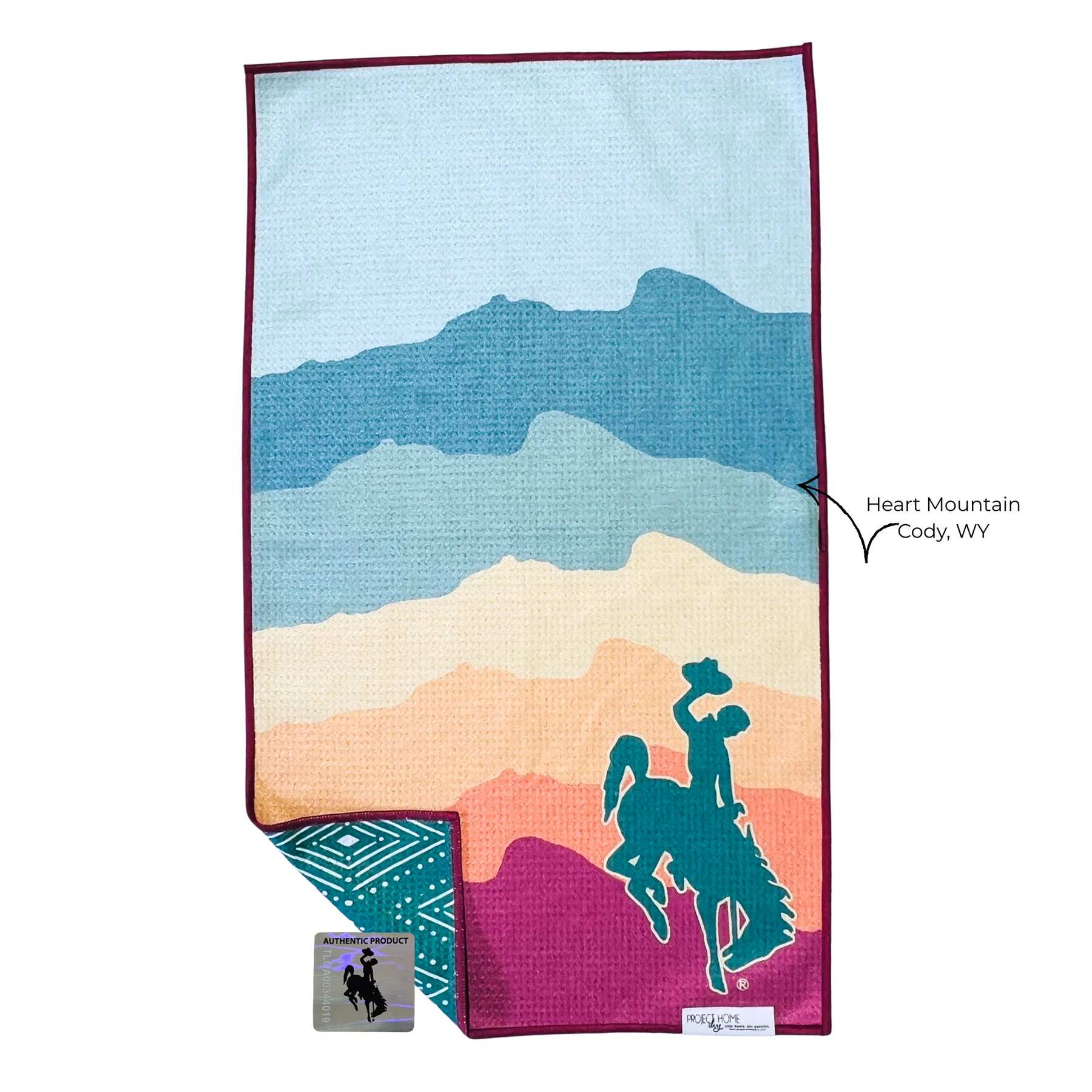 Colorful towel with mountain stripes and a cowboy rider silhouette