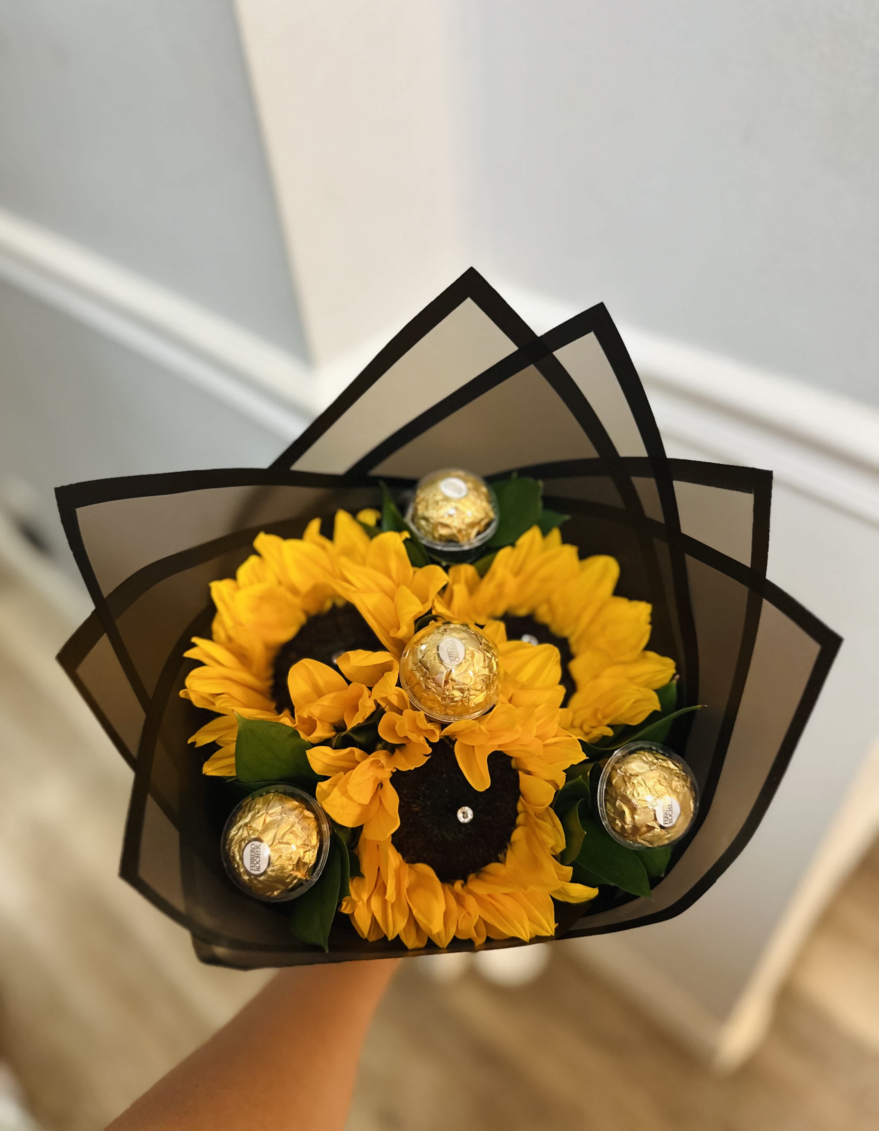Sunflower bouquet with Ferrero Rocher chocolates in black wrap