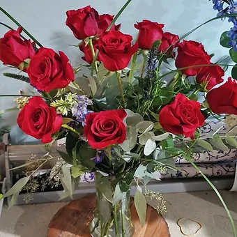 Premium Red Rose Arrangement - 18 Red roses styled with purple delphinium, purple sylvia,  true blue eucaluptus and seeded eucaluptus.