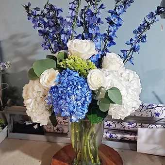 Sea Waltz - Large Display of Blue and White Hydrangea, White Rose, blue delphinium and eucaluptus greenery.