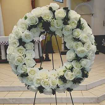 Memorial Rose wreath - 22 inch full floral wreath with greenery accents.  Dozens of open roses, set on 60 inch stand. Requires 48 hour advance notice to prepare.