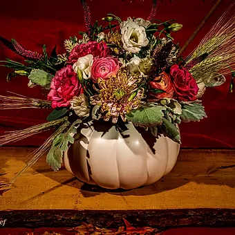 White Modern Pumpkin 11" - Stunning white and pink fall blooms, fern, silver dollar eucaplypus, ranunculus, brassica, cowtail, wheat and garden rose and a blend of seasonal premium blooms make this a stunner for a modern fall table.