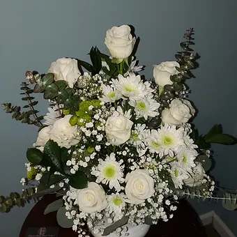 Sympathy urn - White sympaty urn, roses, babysbreath, mums and eucalyptus.