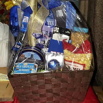 Sports themed basket - Themed giftbasket for your sports lover, we add in 4-5 team logo items and a bunch of sweet and salty treats for them to enjoy.  Fully customizable.