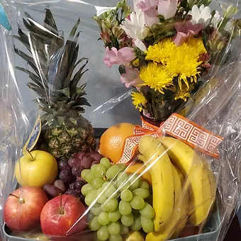 Fruit and flower basket - Medium fruit basket with a small vased floral arrangment.  It makes a great gift and is also a perfect two for one.  