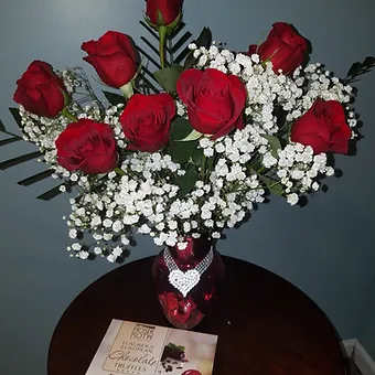 Diamond Hearts &amp; Truffles - Exclusive hearts roses in an ultra premium red murcury glass vase with a diamond heart ribbon.  The Dozen red roses comes adorned with babysbreath and includes a box of luxurychocolate truffles.