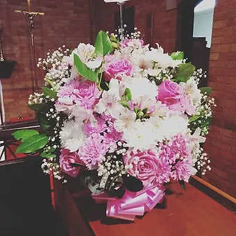 Large Compact Floral Spray - A beautiful spray of premium flowers which can be custom designed with the colors of your chosing.  This is a large piece but designed to be placed on a table top for a memorial or to provide comfort to a loved one in their home.