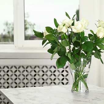 White rose and ruscus - Dozen (short cut)  lovely white roses and lush green ruscus are perfect for any occasion.  Simply elegant.