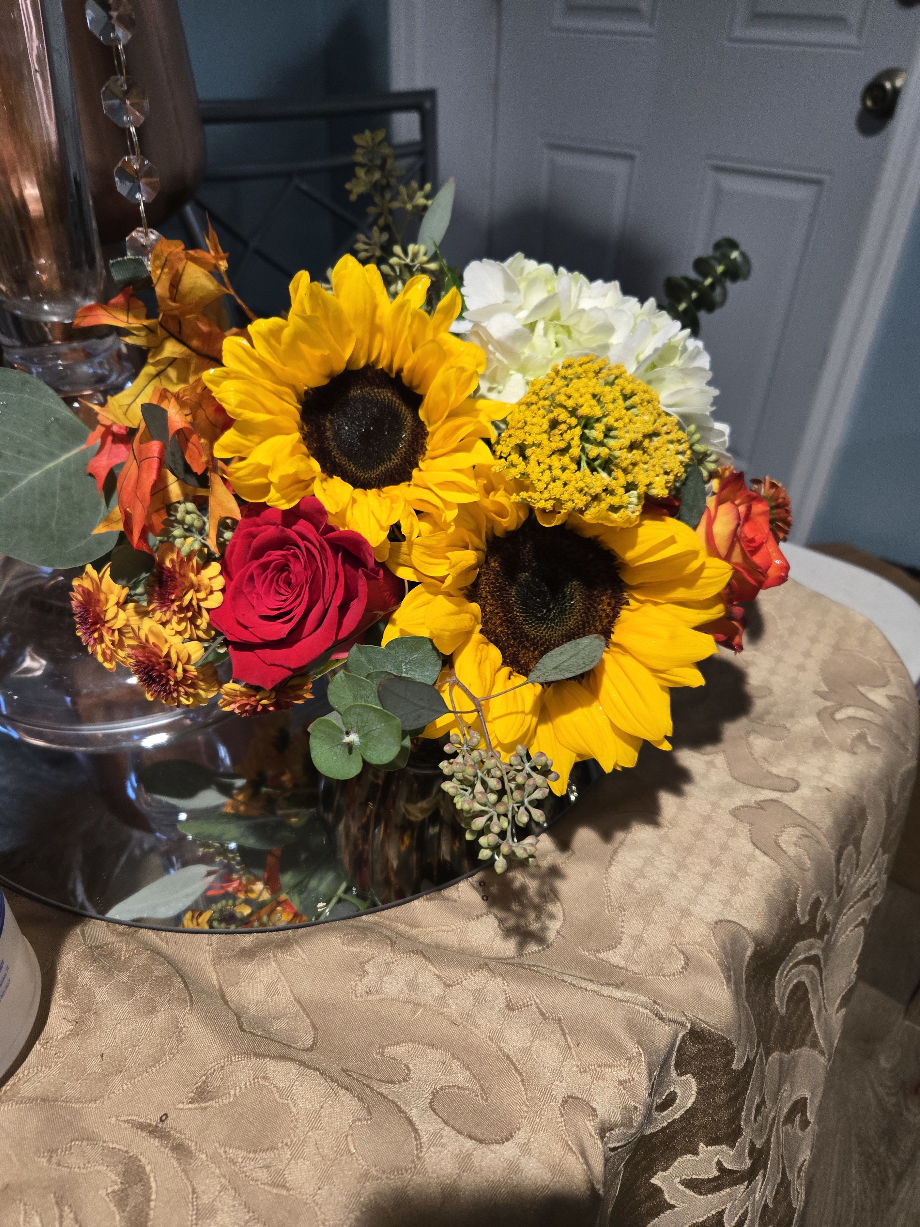 The Bronze pumpkin - bronze pumpkin filled with fall flowers hydrangea, roses, yarrow
