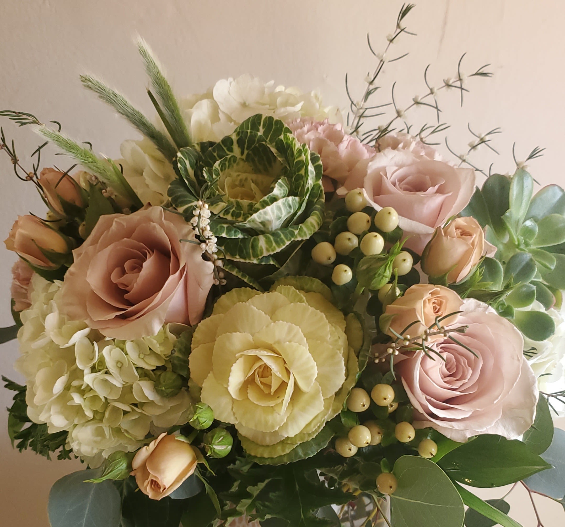 Bouquet of pale pink roses, white hydrangea, and green cabbage roses