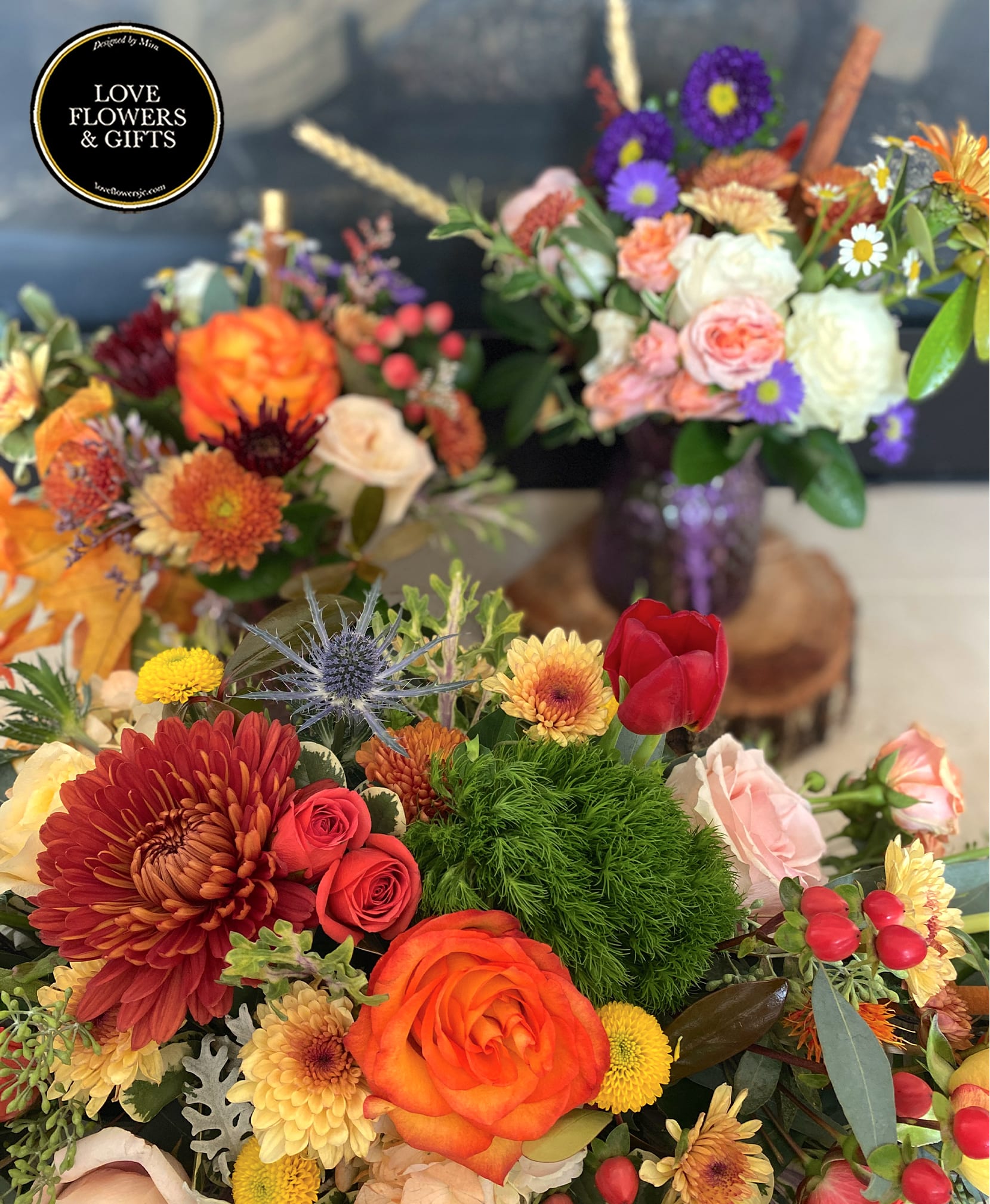 Colorful mixed flower arrangements with orange roses, chrysanthemums, and purple asters in vases
