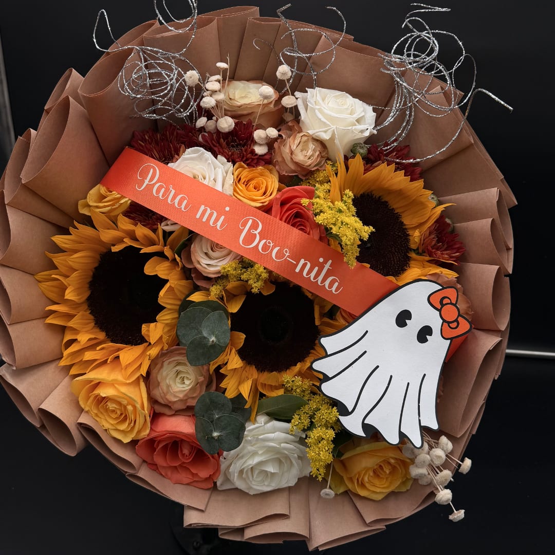 Bouquet of sunflowers and roses with a ghost decoration and ribbon