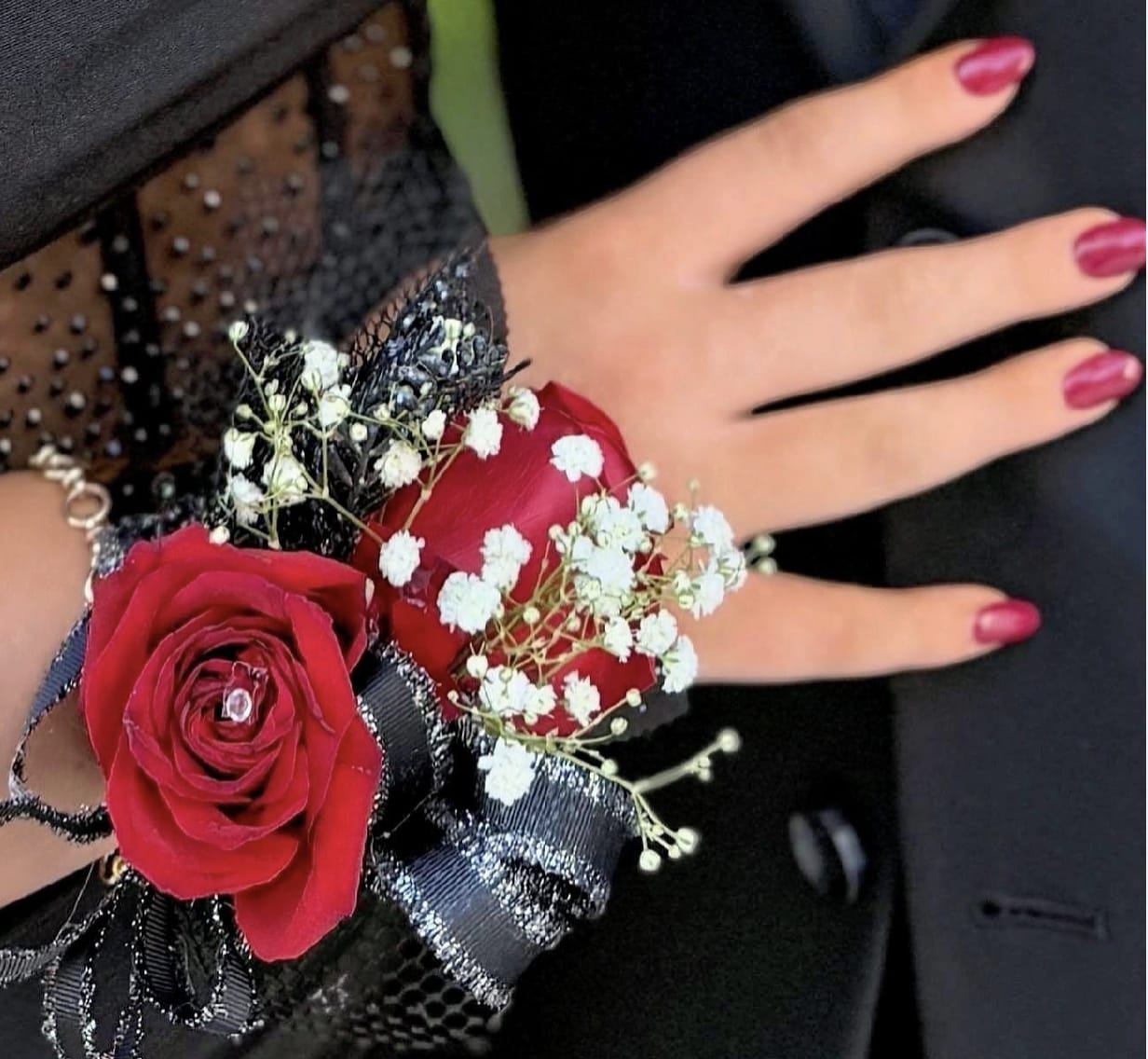 Cuff Corsage by Evergreen Elegance  - Worn on the wrist with a choice of gold or silver bracelet- this classic red rose corsage is paired with luxe greenery and baby’s breath with ribbon of your choice