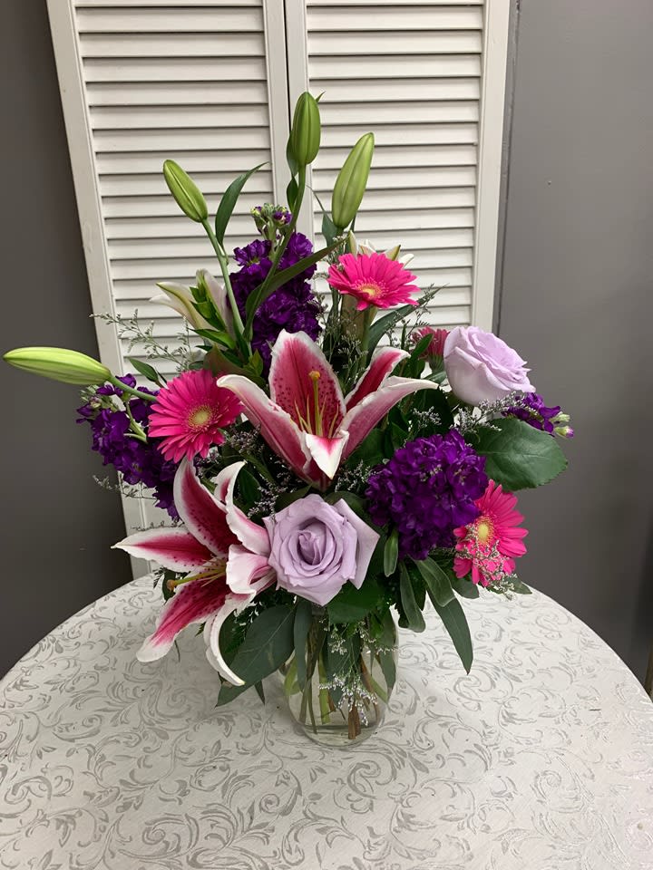 Fragrant Flowers from the Garden - Arrangement includes Stargazer Lilies, Gerbera Daisies, Stock, Roses and Caspia. Flowers may vary.