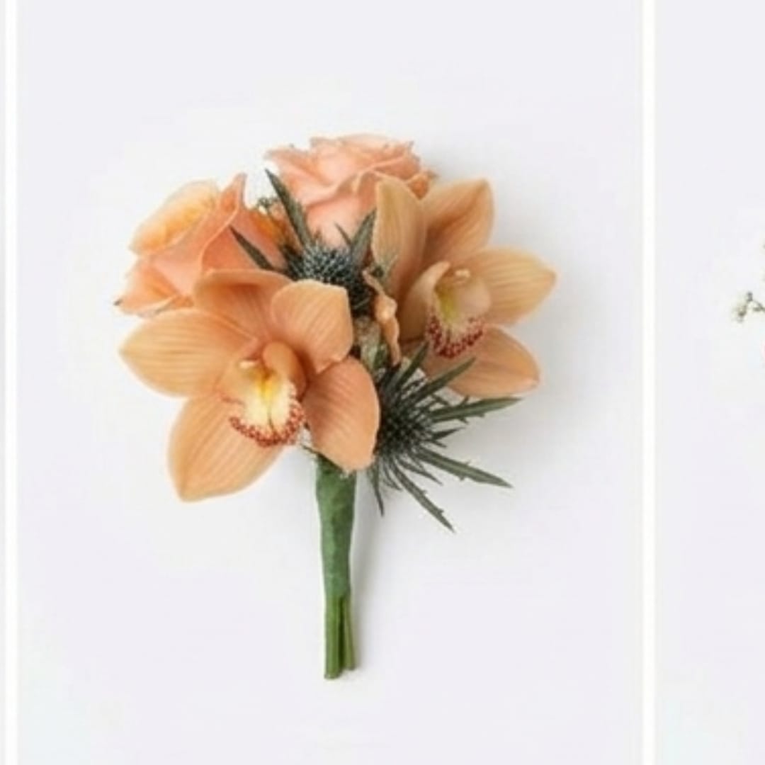 Peach orchid bouquet with dark accent foliage on a white background