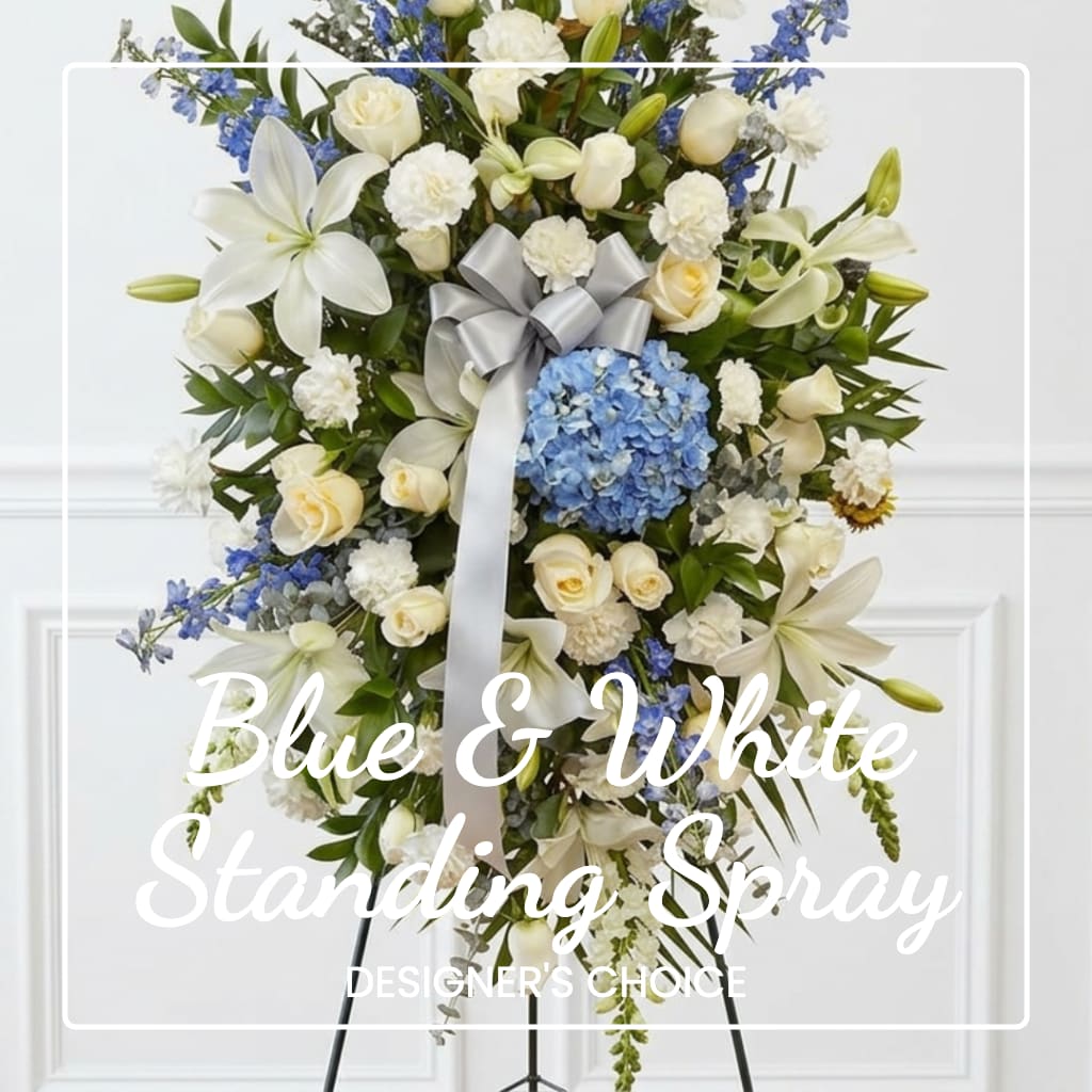 Blue and white standing spray with roses, lilies, and hydrangea on an easel