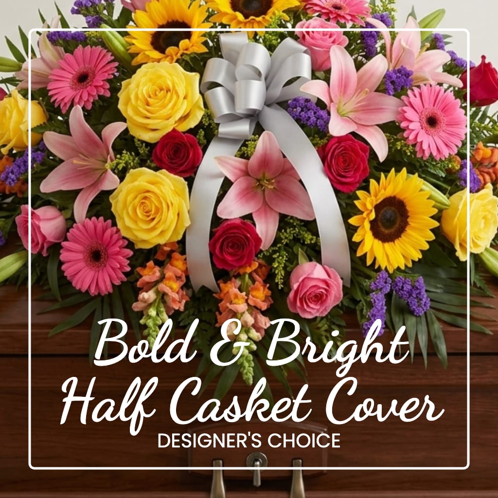 Bright mixed flower casket cover with a silver bow