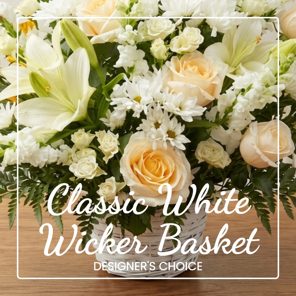 White and peach flowers arranged in a wicker basket