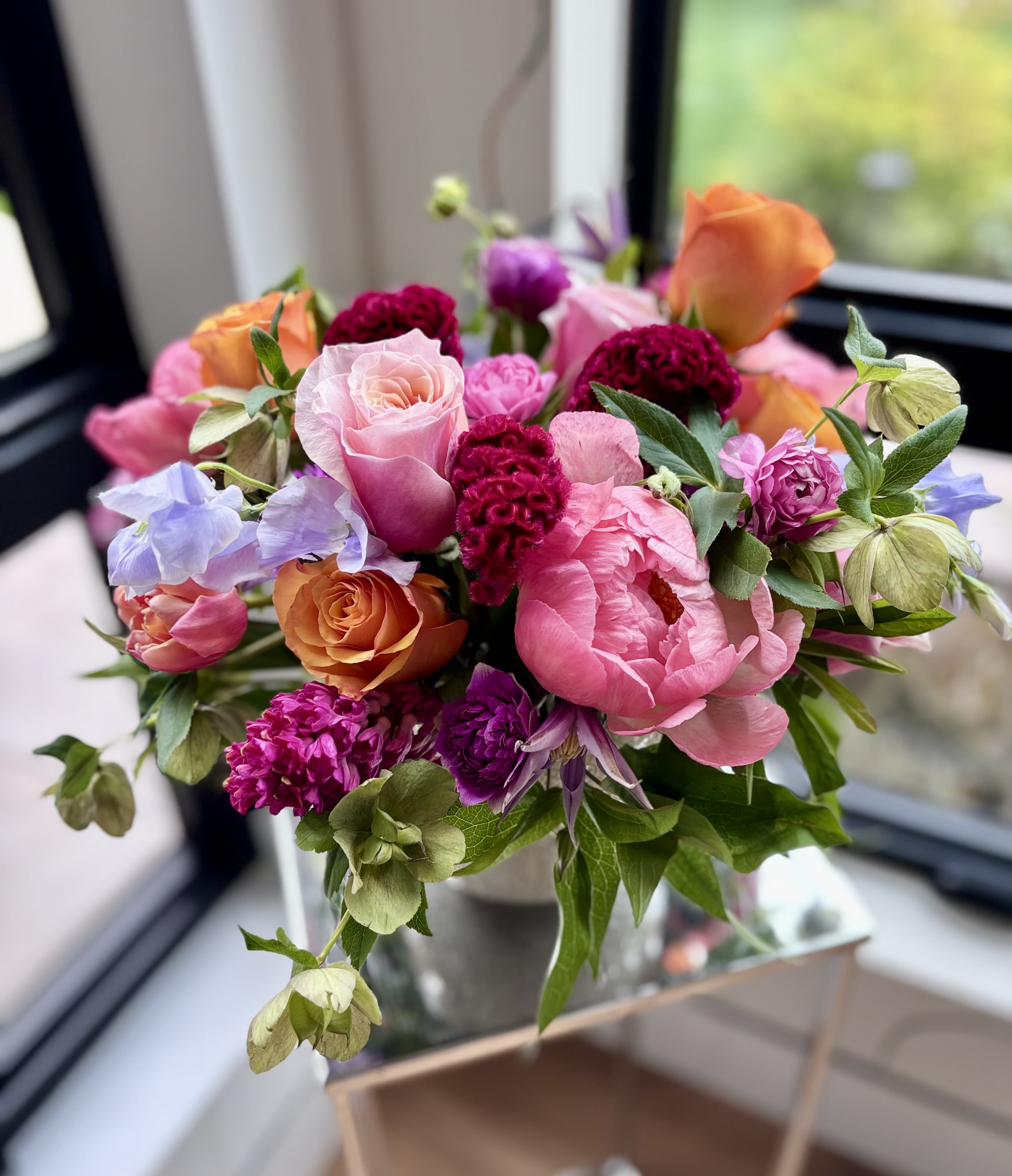 Flower Crush - A colorful fresh flower centerpiece with a wide variety of premium flowers and greenery arranged in a ceramic vase. The flower mix may vary but I always create a stunning lush flower arrangement using high quality of flowers such as roses, peonies (when available), ranunculus, anemone, tulips, sweet peas, gerber daisies, clematis and more.