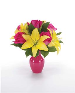 Celebrate the Day - Product ID: BF7-11K  Brighten her day with a gorgeous array of lilies and roses in a bright bud vase. Measures 13"H by 10"L.