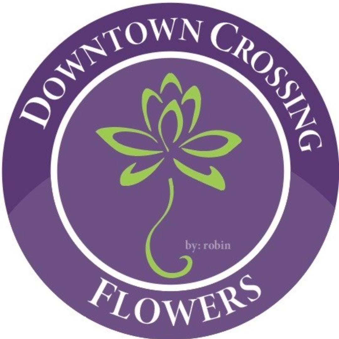 Purple Downtown Crossing Flowers logo with a green floral icon