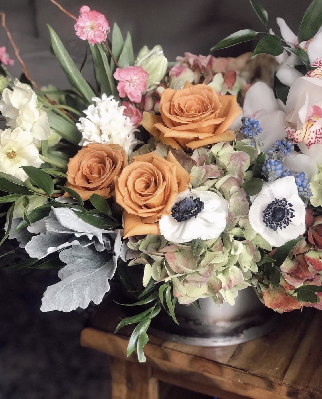 Toffee Elegance  - So many luxurious blooms in this arrangement! From toffee roses to anemones! Orchids, tulips, you just get about everything in this one! 