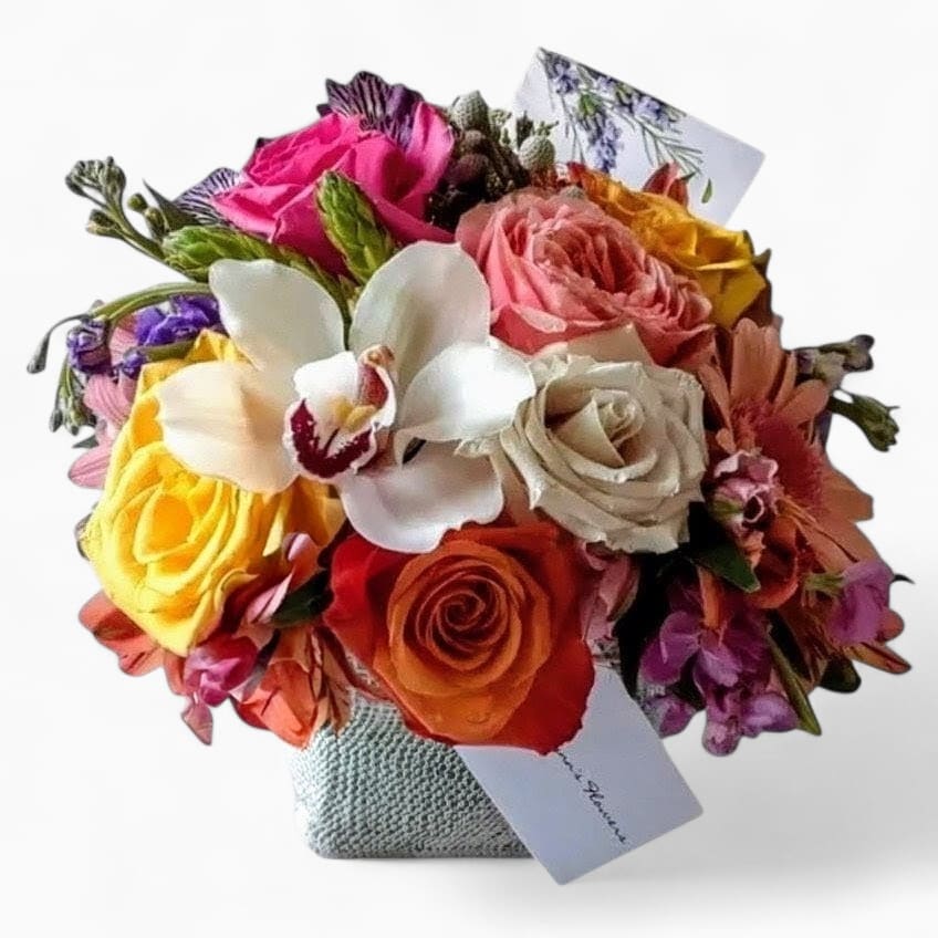 Colorful bouquet of roses and orchids in a textured wrap