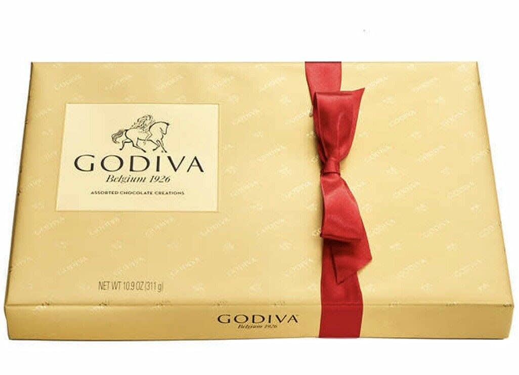 Gold Godiva chocolate gift box with a red ribbon