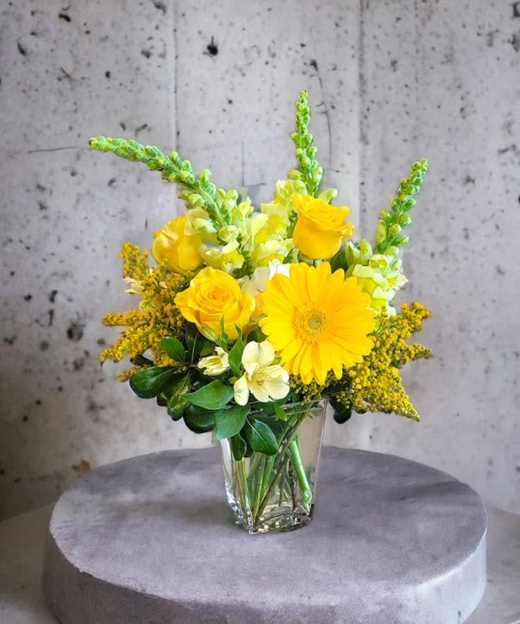 Sun Kisses - This Beautiful sunshine brings the most bright smiles to the special person, design with beautiful daisies and  yellow roses with a dancing snapdragons perfect to bring someone day.