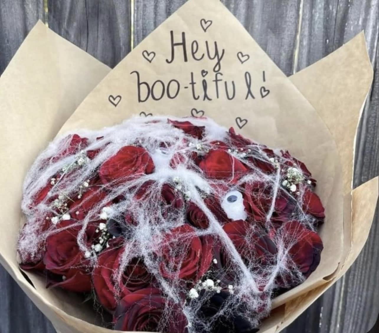 Spooky Love - Got a girl who just absolutely loves fall and Halloween? We get it! And we got you! These two dozen spookily arranged roses are sure to wow and bring a smile to any recipient. This description is for the deluxe option. We do offer a smaller one dozen standard bouquet as well. See pricing below. 
