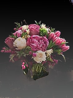 Pink and white bouquet in a clear glass vase