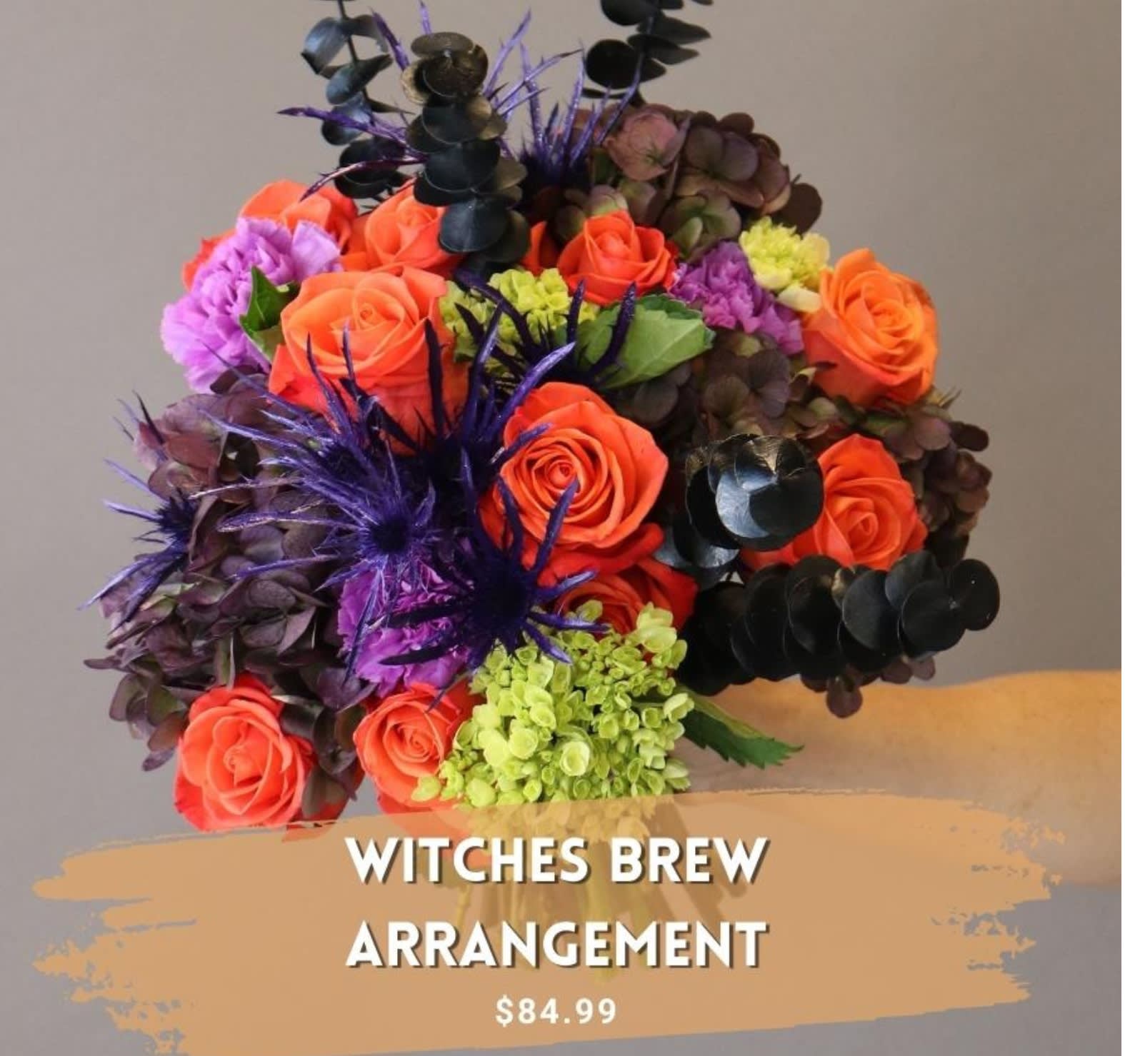 Halloween's Witches Brew Bouquet - Send this Spook-Tactular fresh flower arrangement to that person who goes overboard on Halloween. You know the guy with all the skeletons on the front yard and the rope that looks like a spider web hanging from the 2nd story &amp; the neon florescent lights. Lets make their holiday.