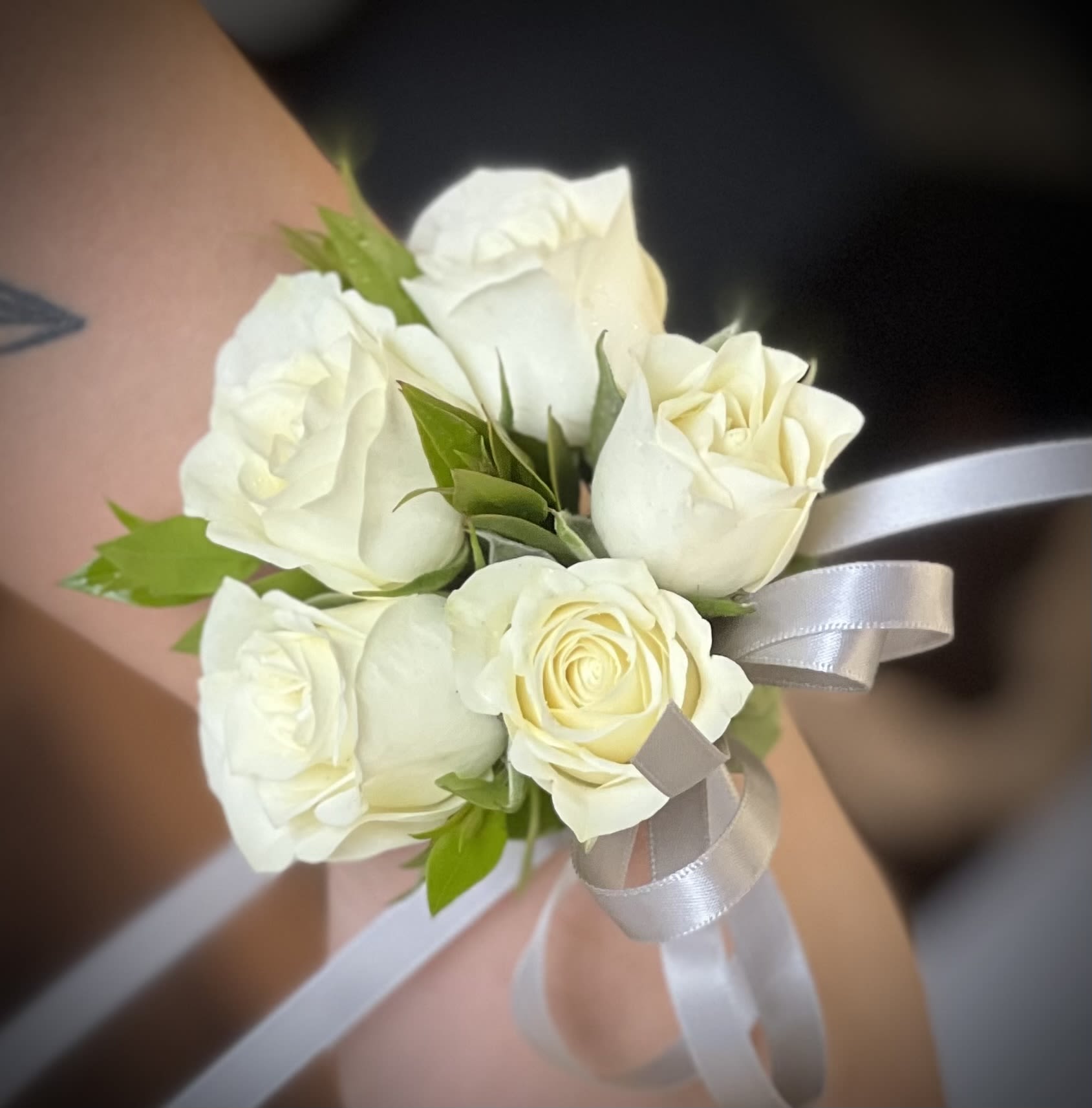 Small bouquet of white roses with a silver ribbon