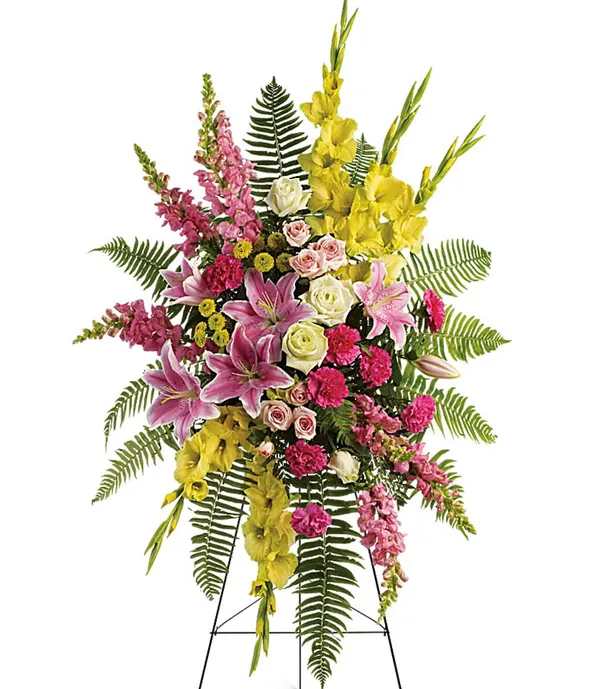 Rays of Light Spray - Send your deepest condolences with these tropical sympathy flowers for the service. The bright yellows and peaceful pinks in this standing spray create an impressively balanced display