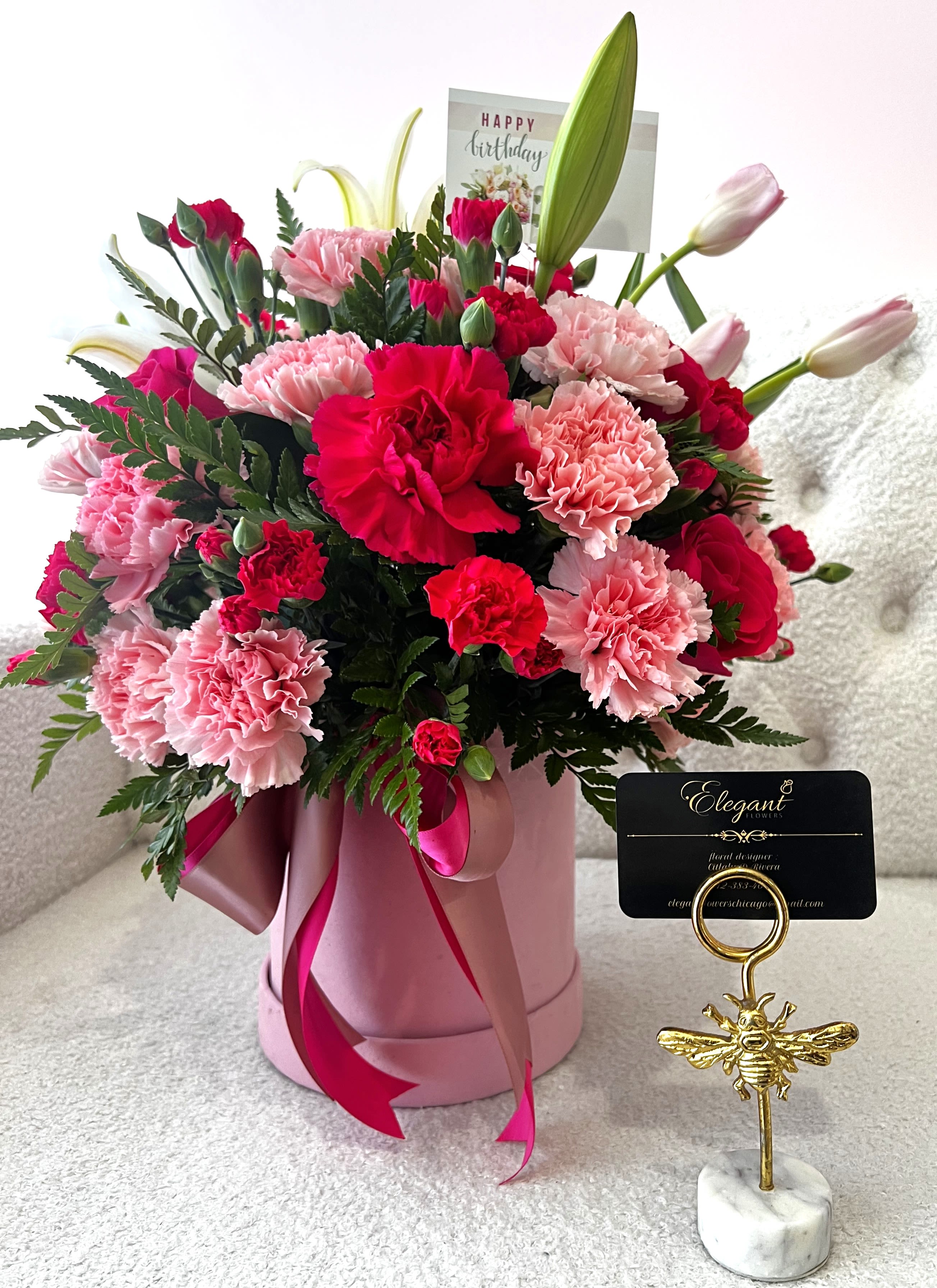 Pink and red carnation bouquet in a pink hatbox with a birthday card