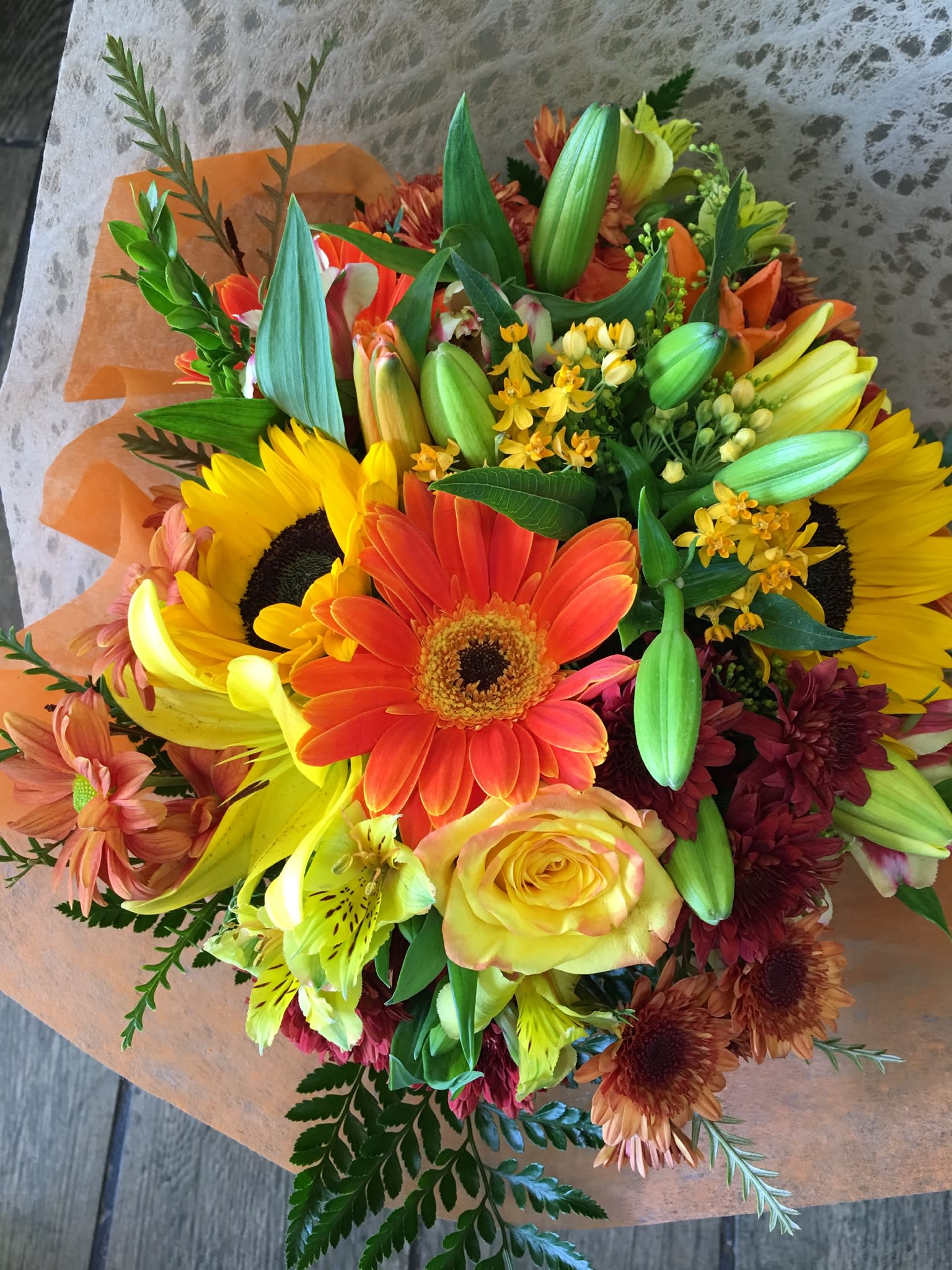 Glory Fall  - Hand tied bouquet consist of assortment of fall flowers wrap in tissue paper or craft paper 