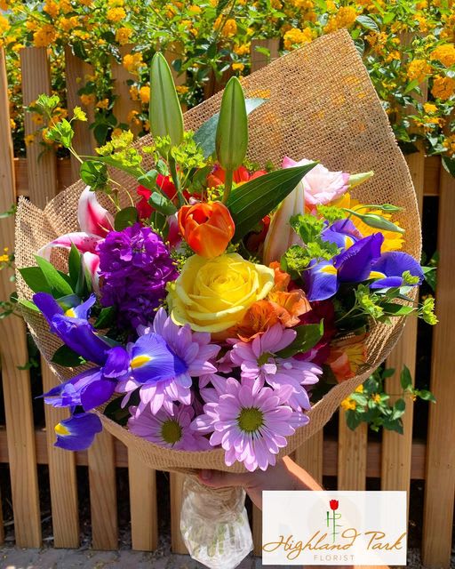 Bouquet of Sunshine - Seasonal bright color flowers arranged into a hand-tied bouquet with burlap. 