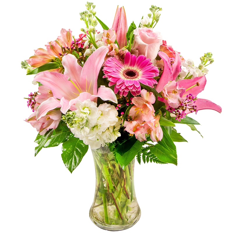 Pink and white mixed bouquet in a clear glass vase