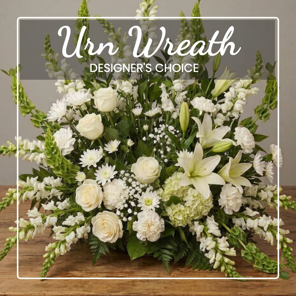 White floral wreath with roses, lilies, and snapdragons