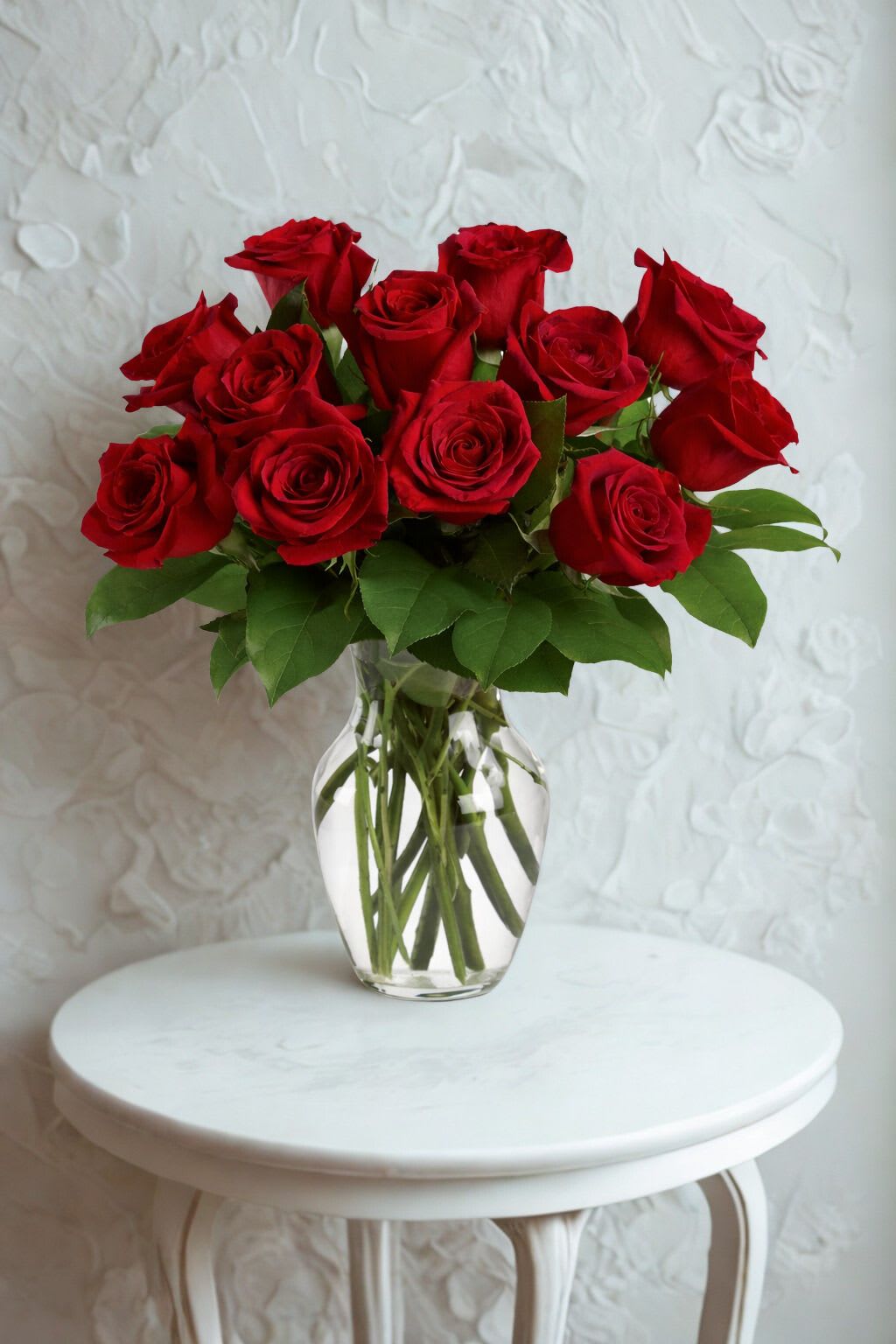 Bouquet of red roses in a clear glass vase