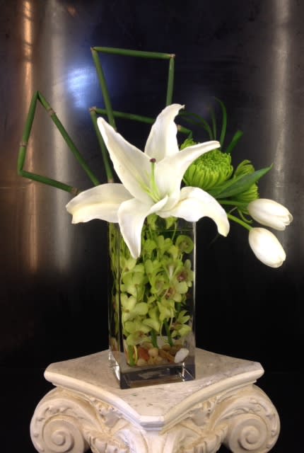 The Magazine Street - submerged orchids topped with green spider mums, tulips and lily.