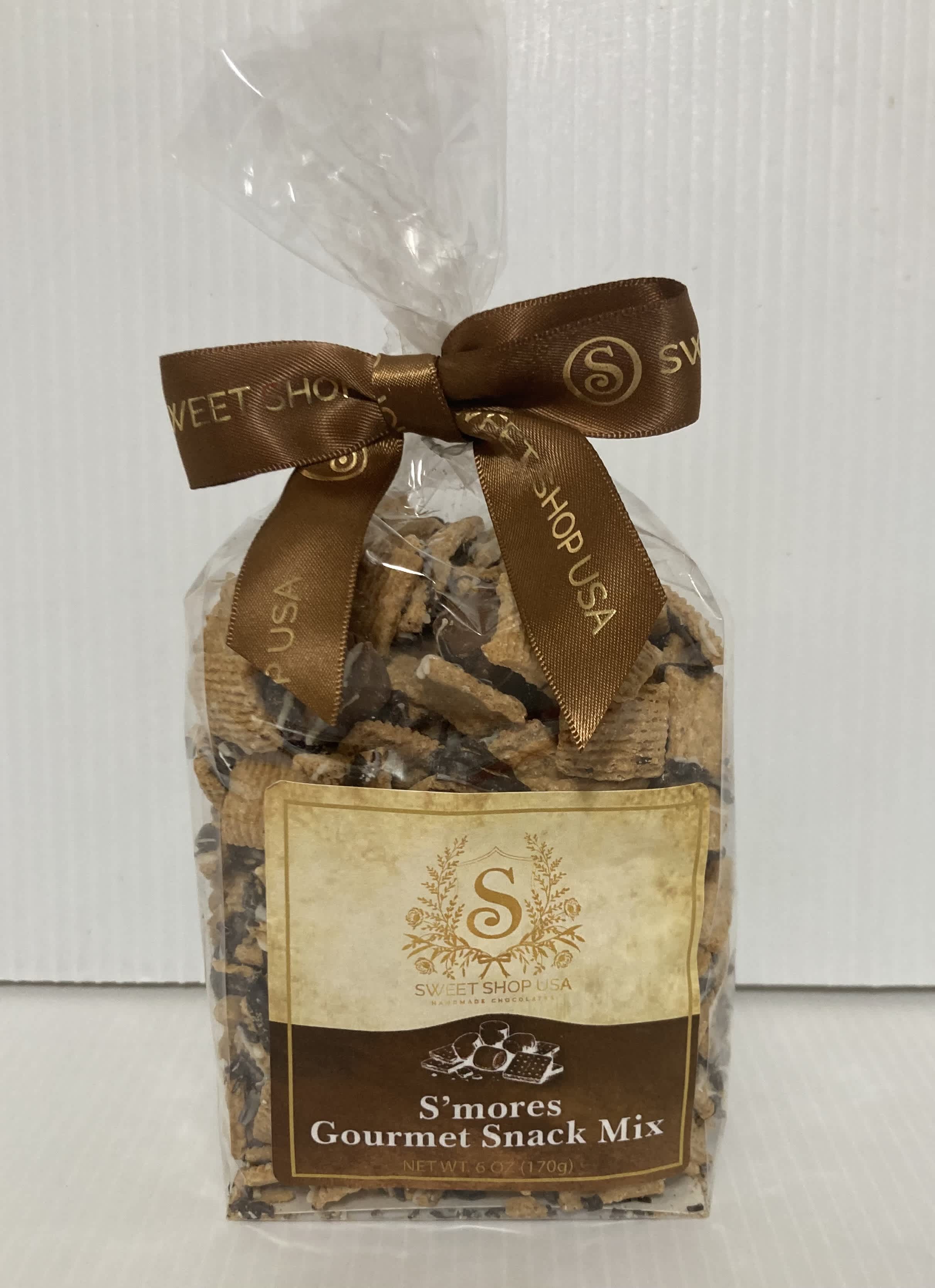 Bag of s'mores gourmet snack mix tied with a brown ribbon