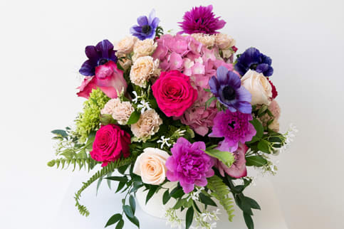 Elizabeth's Grandeur - Radiant seasonal blooms arranged with elegance and artistry. A radiant celebration of color, craftsmanship, and seasonal elegance, Elizabeth’s Grandeur is our signature bouquet - designed to showcase the finest flowers of the moment. Inspired by our commitment to luxurious, thoughtfully crafted arrangements, this design embodies the elevated artistry Elizabeth’s Garden is known for, offering a gift that feels both premium and personal. Our dedication to creating luxurious seasonal arrangements echoes what our customers love most about us.  A vibrant blend of premium blooms, like lush petite garden roses, vivid ranunculus and anemones, elegant hydrangeas, and richly textured accents, creates a spectacular display that feels both modern and timeless. Each flower is selected at its peak, ensuring exceptional freshness and beauty that reflect the season’s most exquisite offerings. Perfect for life’s most meaningful celebrations, Elizabeth’s Grandeur brings a sense of joy, elegance, and abundance to any space. Whether gifted to someone special or enjoyed as a personal centerpiece, it captures the heart of what we do best: crafting exceptional floral designs with care, passion, and creativity.  Elevate every moment with Elizabeth’s Grandeur - a bouquet that truly lives up to its name.