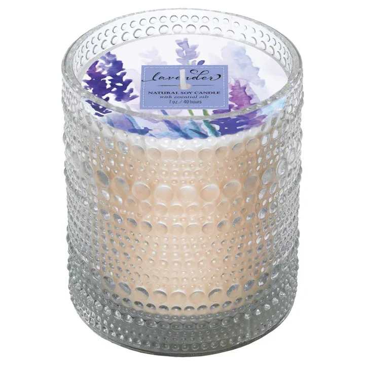 Lavender Soy Candle 7 oz - The calming fragrance of lavender with tonka bean is the perfect way to create a relaxing environment. This earth and mood friendly hand-poured candle sits in a recycled, reusable glass container. Enjoy 40 hours of aromatherapeutic attitude adjustment made right here in the USA. Approximate dimensions are 2.75 x 2.75 x 3.1 inches.