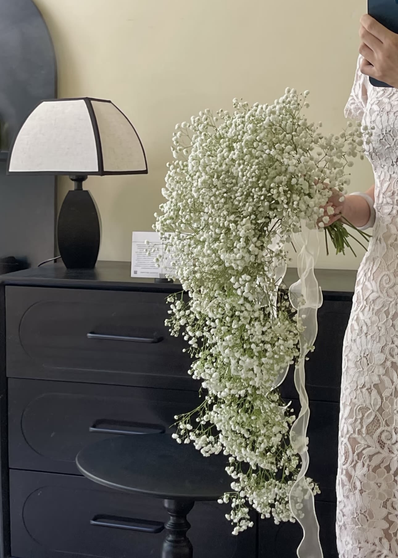 Large cascading bouquet of white baby's breath with a ribbon tie