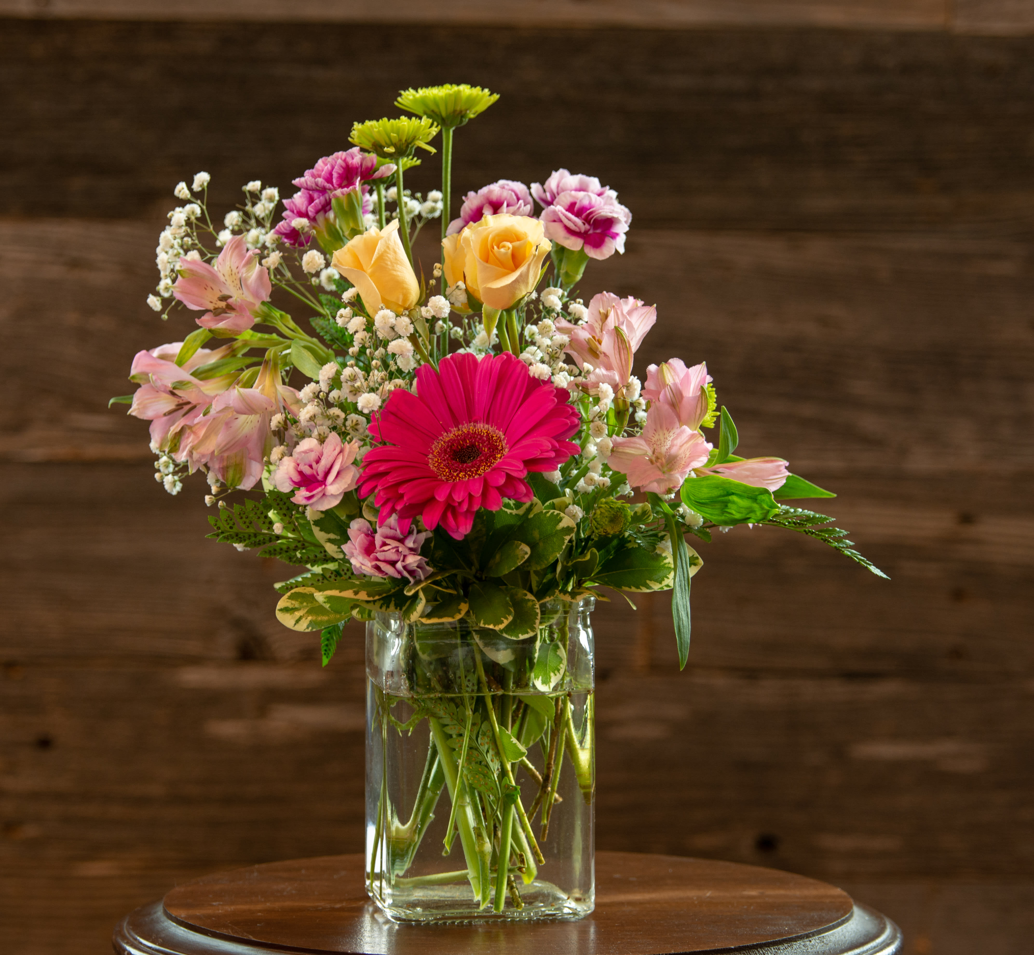 Making a Splash - This arrangement looks like the gerbera daisy decided to splash right into the middle of all the other flowers.  