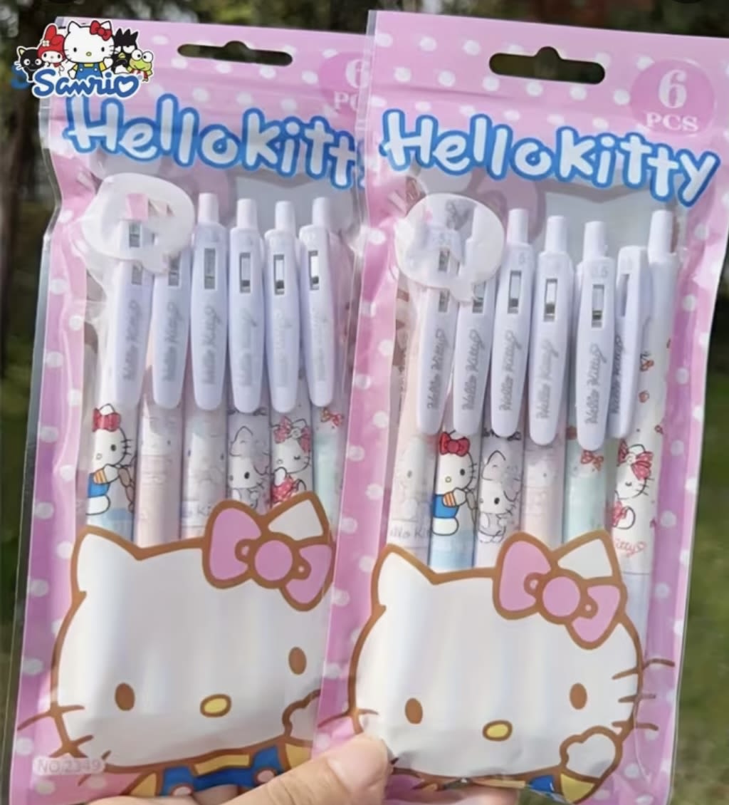 Two Hello Kitty pen sets in pink packaging