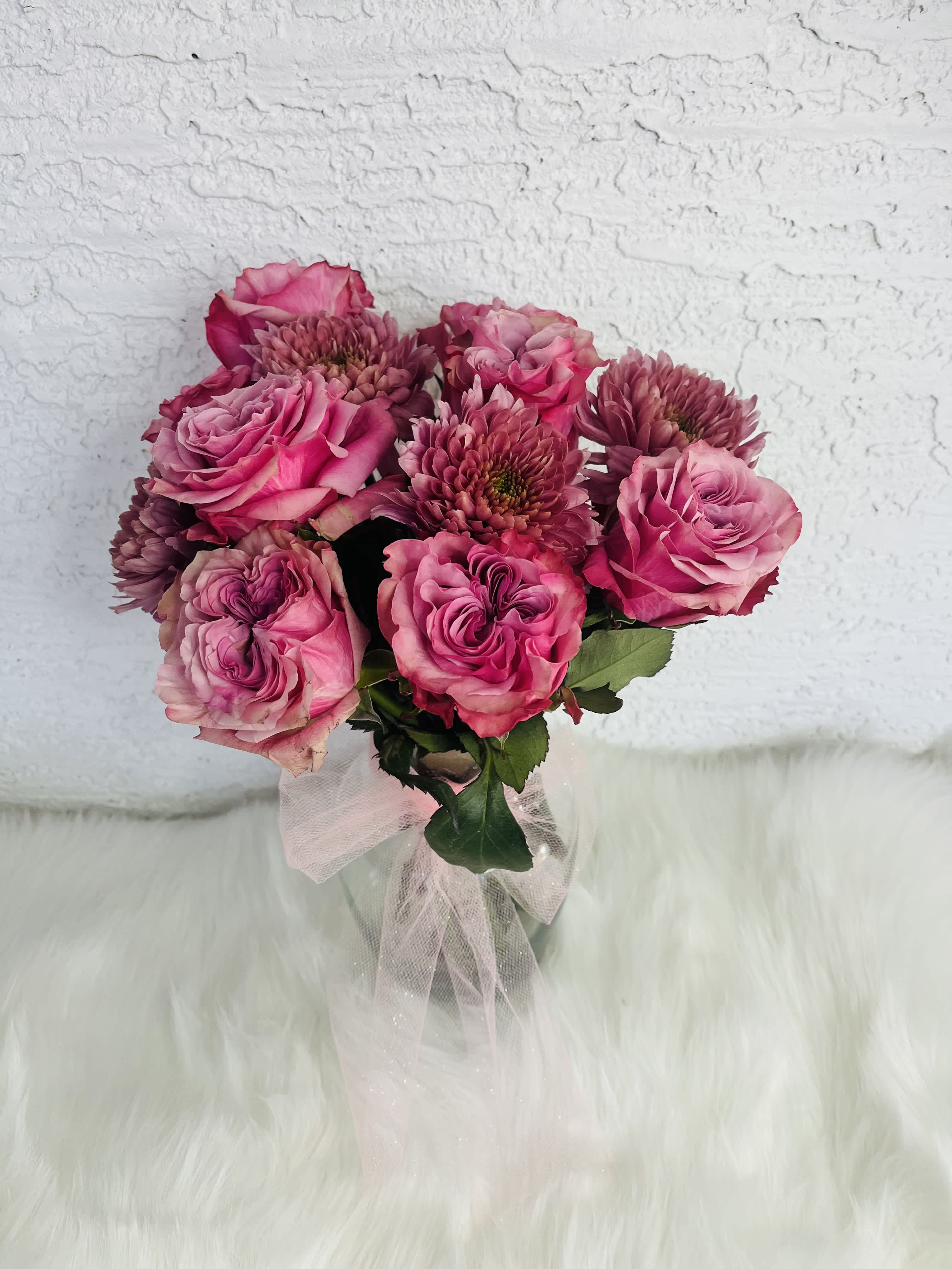 Pink rose bouquet with chrysanthemum blooms tied with a sheer ribbon