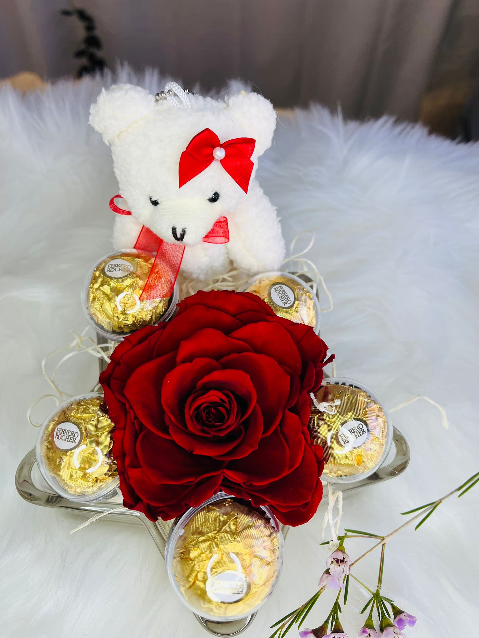 Red rose arrangement with a teddy bear and Ferrero Rocher chocolates